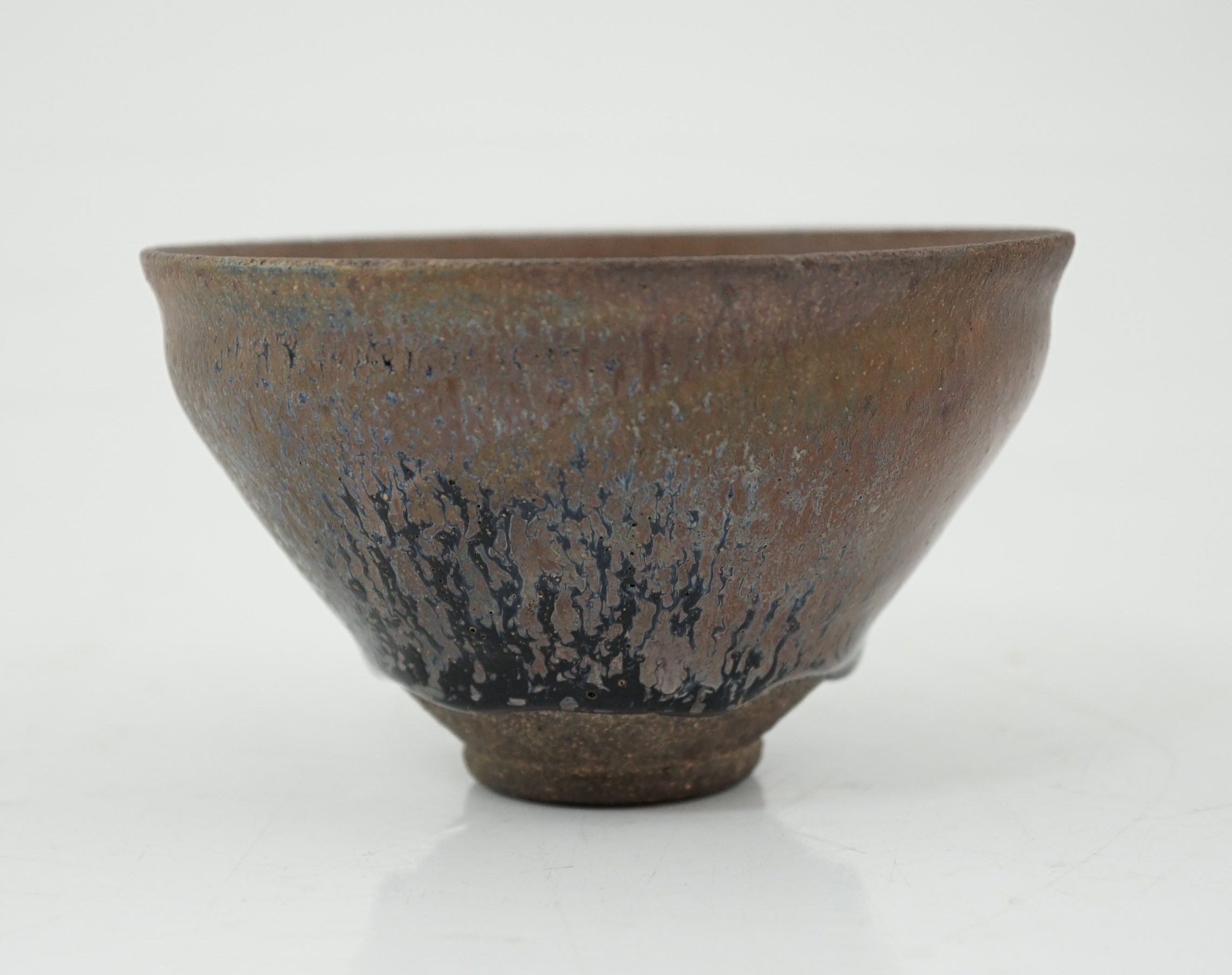 A Chinese 'hares fur' pottery bowl, Song Dynasty with a thick glaze pooling above the unglazed base, 12.2cm diameter. Provenance - Robert Ricketts collection. Condition - good
